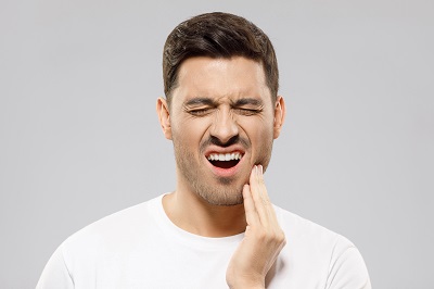 man that has tooth pain