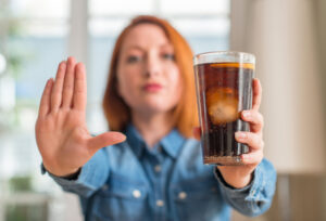 woman holding a pop