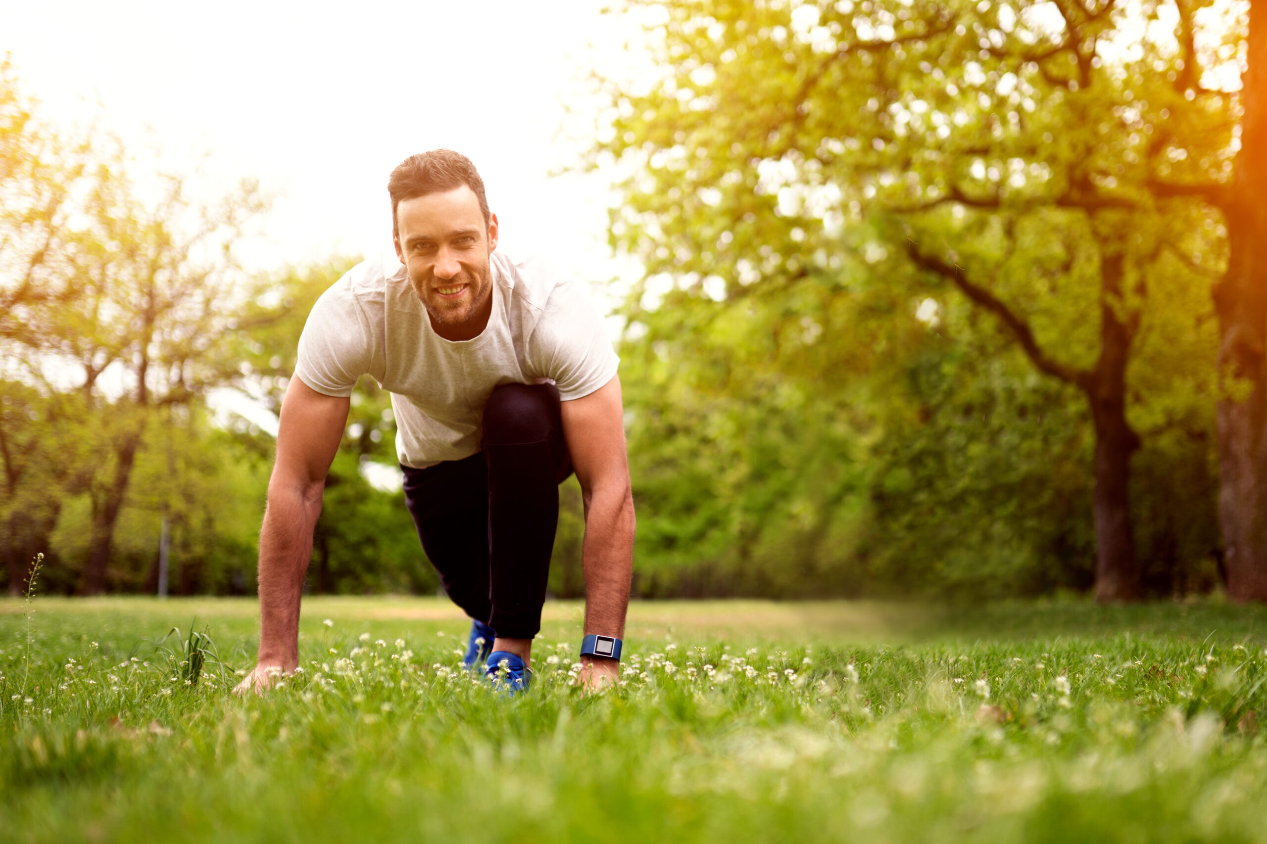 Young man in grass field