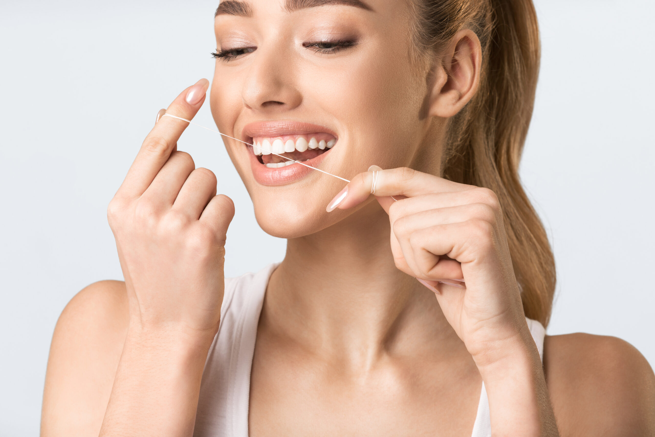 Woman Flossing